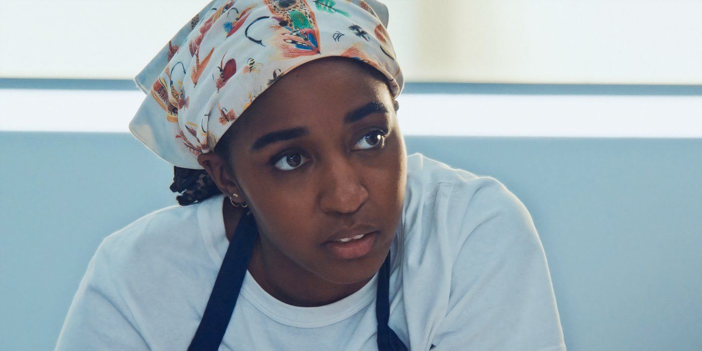 Sydney (Ayo Edebiri) looking intensely at something offscreen to the right in The Bear.