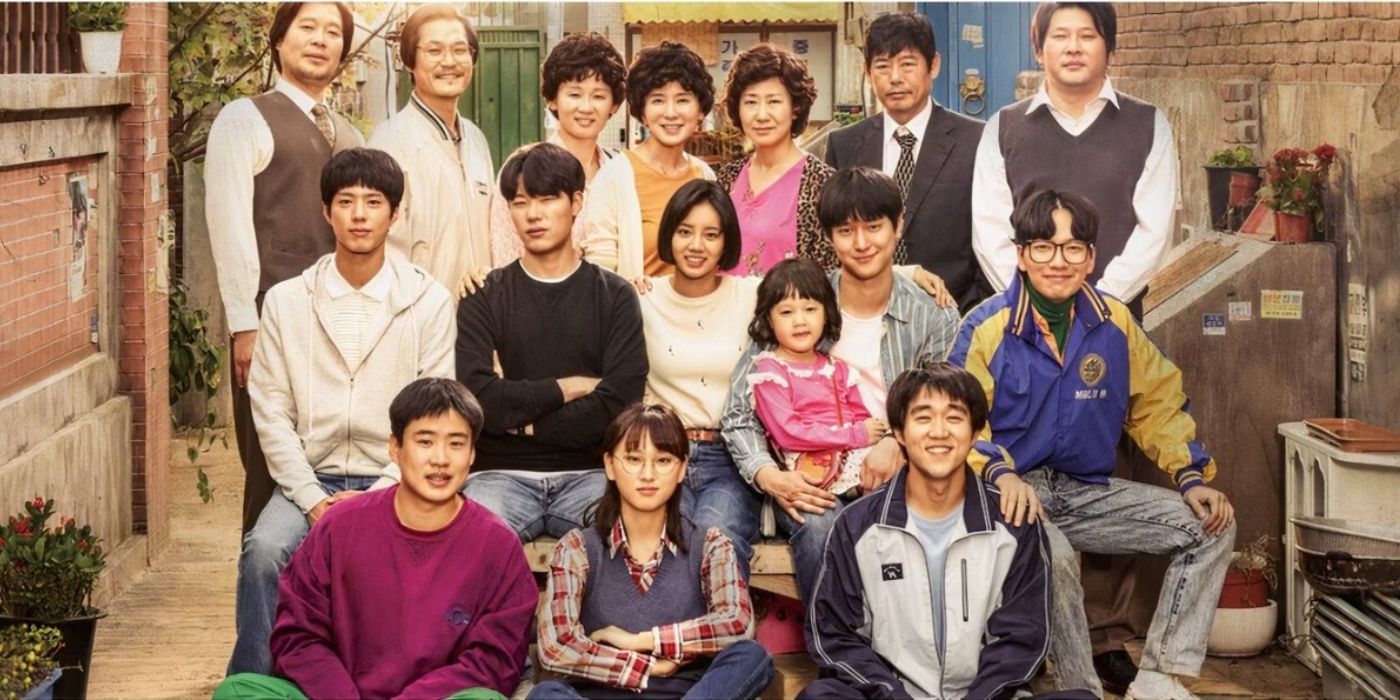 The cast of Reply 1988 posing together in an alley.