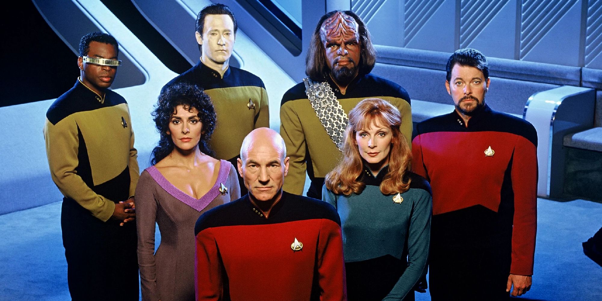 The cast of Star Trek The Next Generation looks up at the camera in a promotional shoot