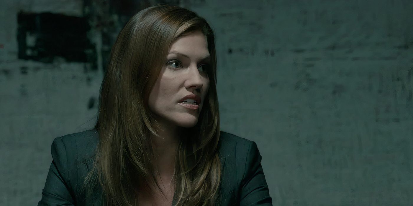 A woman looking to her left in The Firm