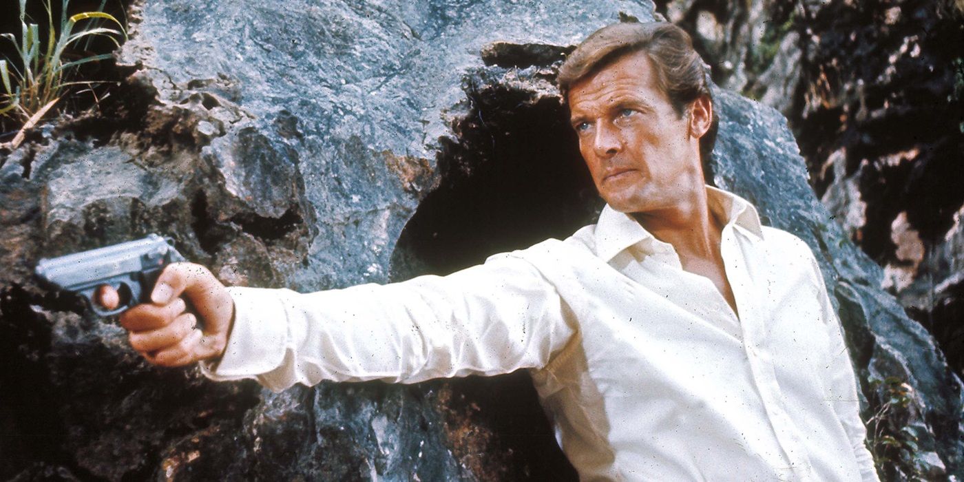 Roger Moore as James Bond pointing his gun at a target offscreen in The Man With a Golden Gun