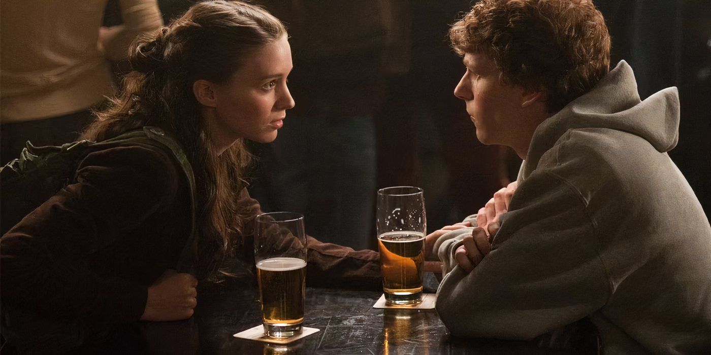 Rooney Mara as Erica (left) and Jesse Eisenberg as Mark (right) talk over their beers in 'The Social Network'