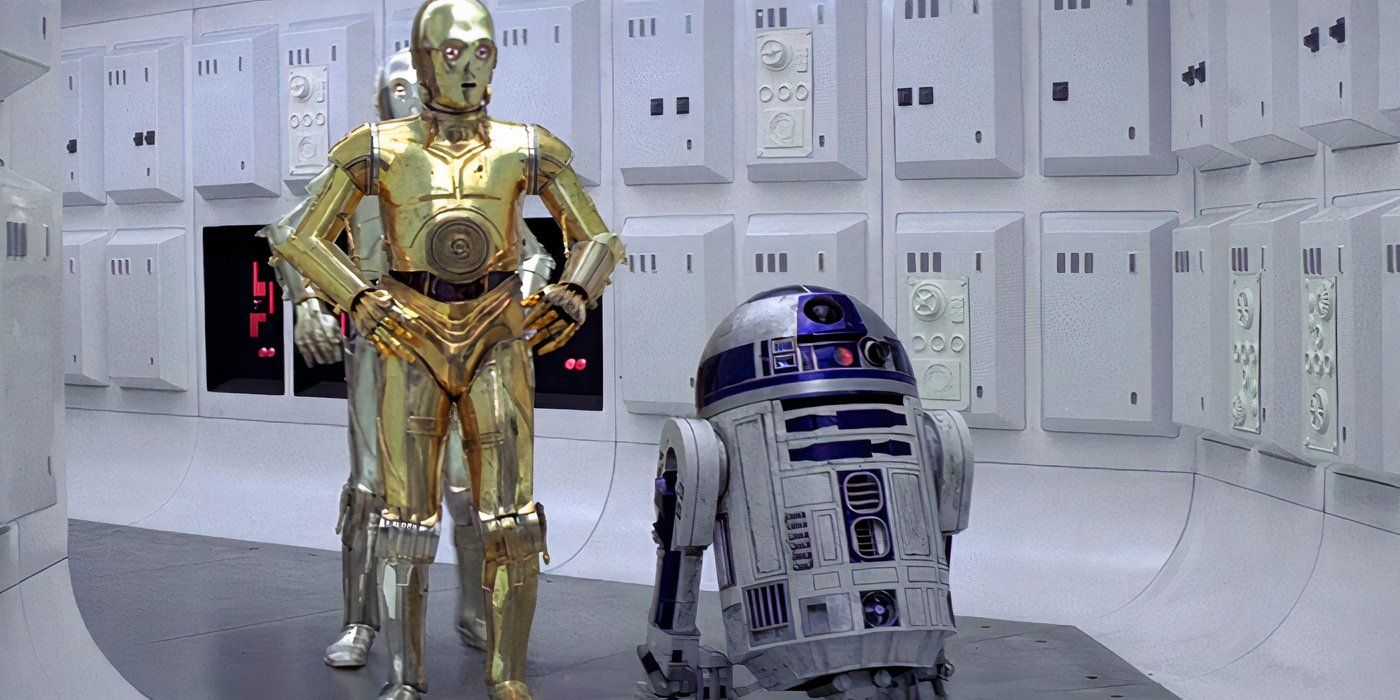 C-3PO walks down a corridor next to R2-D2 in 'Star Wars: Episode IV - A New Hope' (1977)