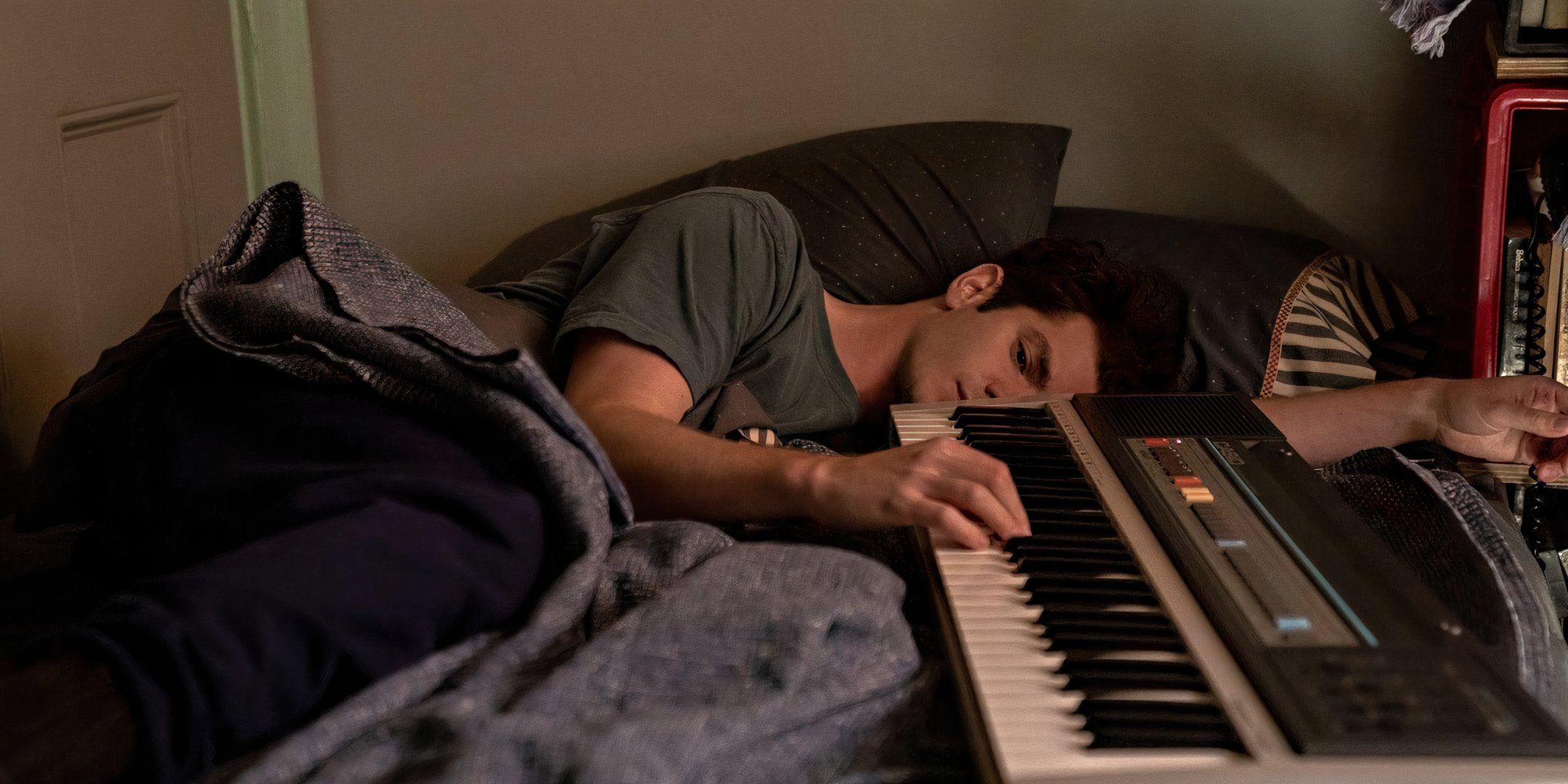 Jonathan Larson (Andrew Garfield) falls asleep at his keyboard in &lsquo;Tick, Tick&hellip; Boom!&rsquo; (2021)