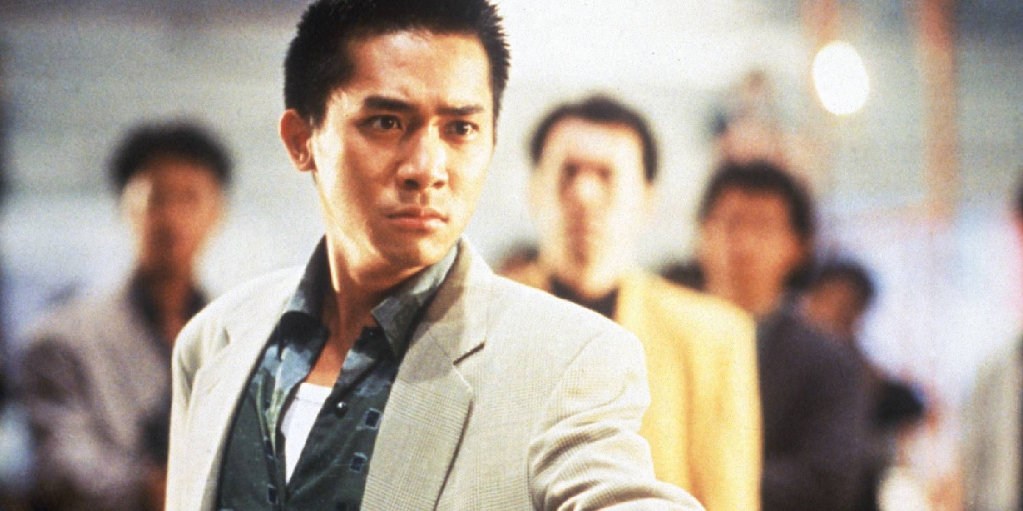 Tony Leung as Alan in Hard Boiled looking at something off-camera