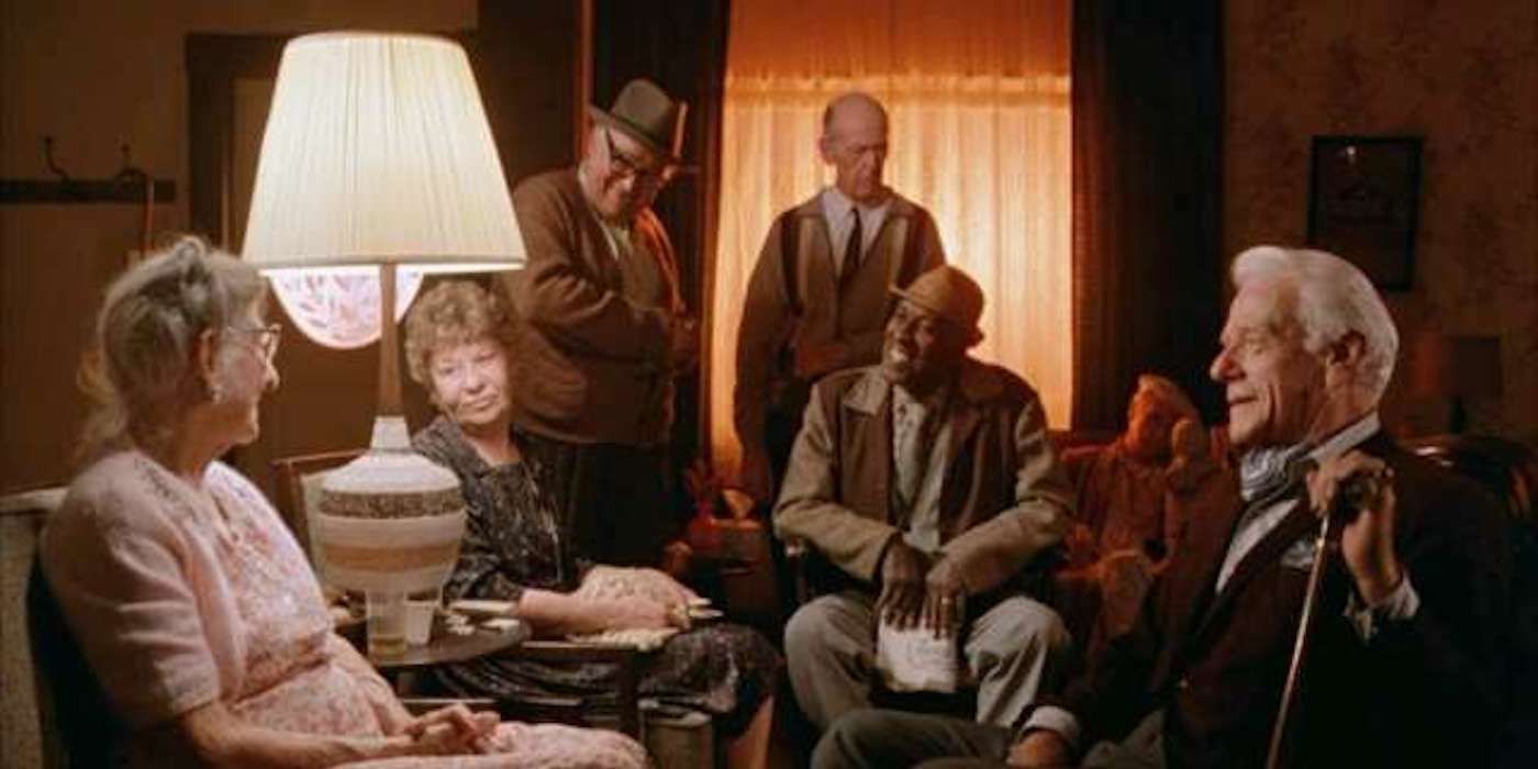 A group of old people in a circle laughing in The Twilight Zone Movie