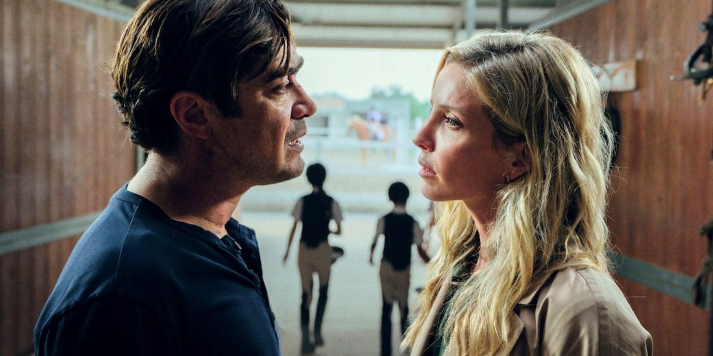 Riccardo Scamarcio and Annabelle Wallis stare at each other in Vanished into the Night