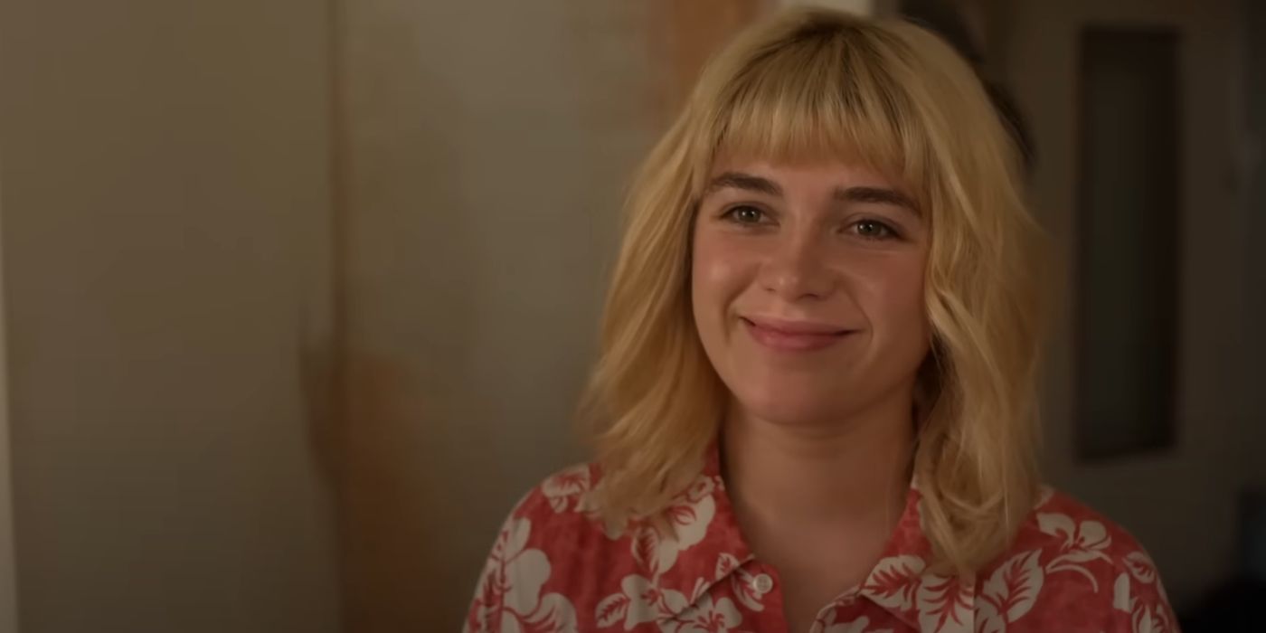 Florence Pugh with blonde bangs, smiling, in We Live in Time.