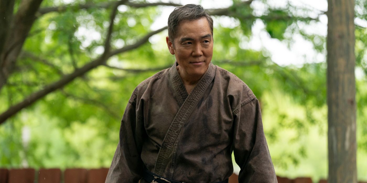 Yuji Okumoto wearing a brown karate gi as Chozen in Cobra Kai Season 6 Part 1.