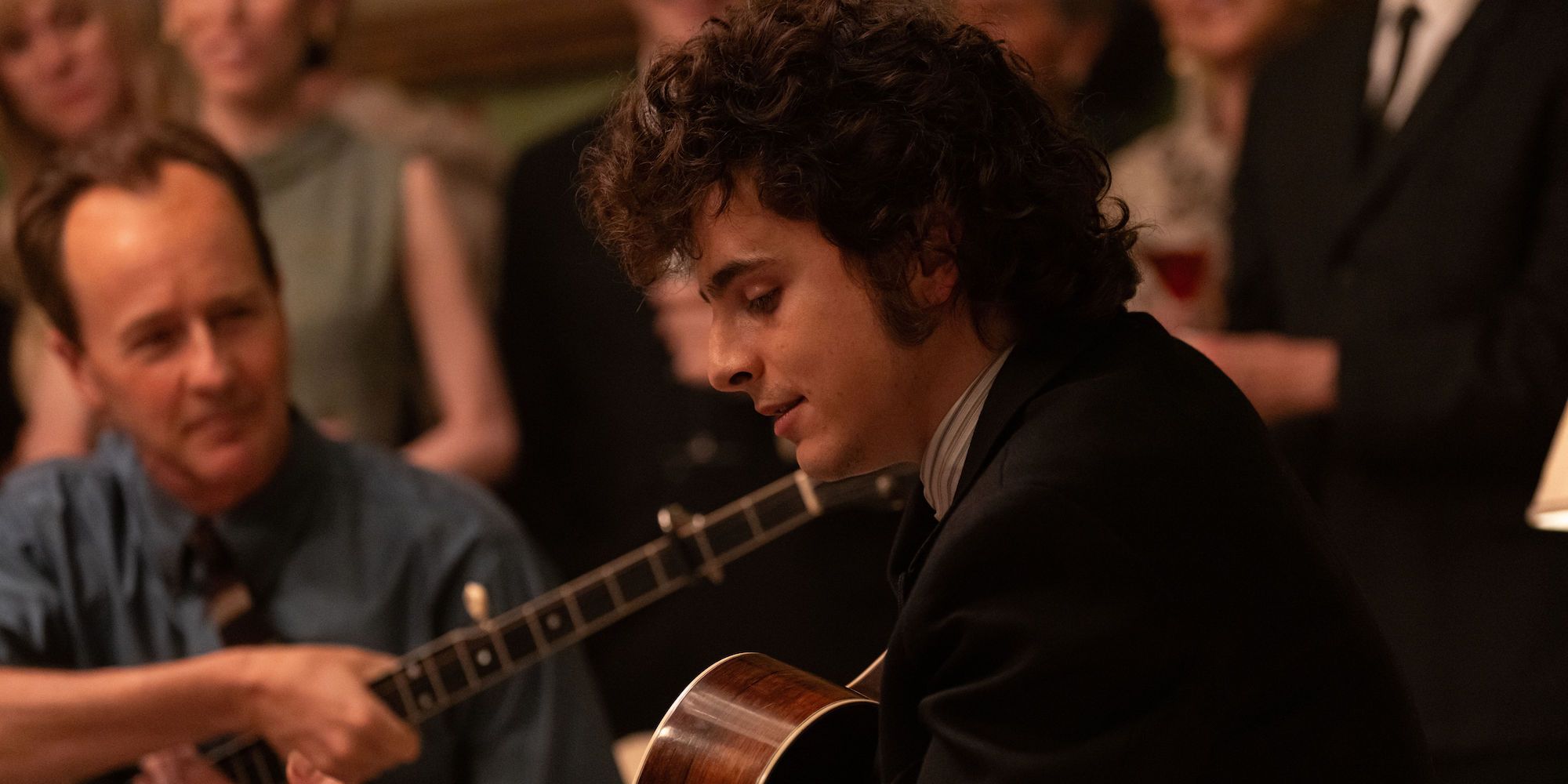 Edward Norton as Pete Seeger and Timothée Chalamet as Bob Dylan in A Complete Unknown