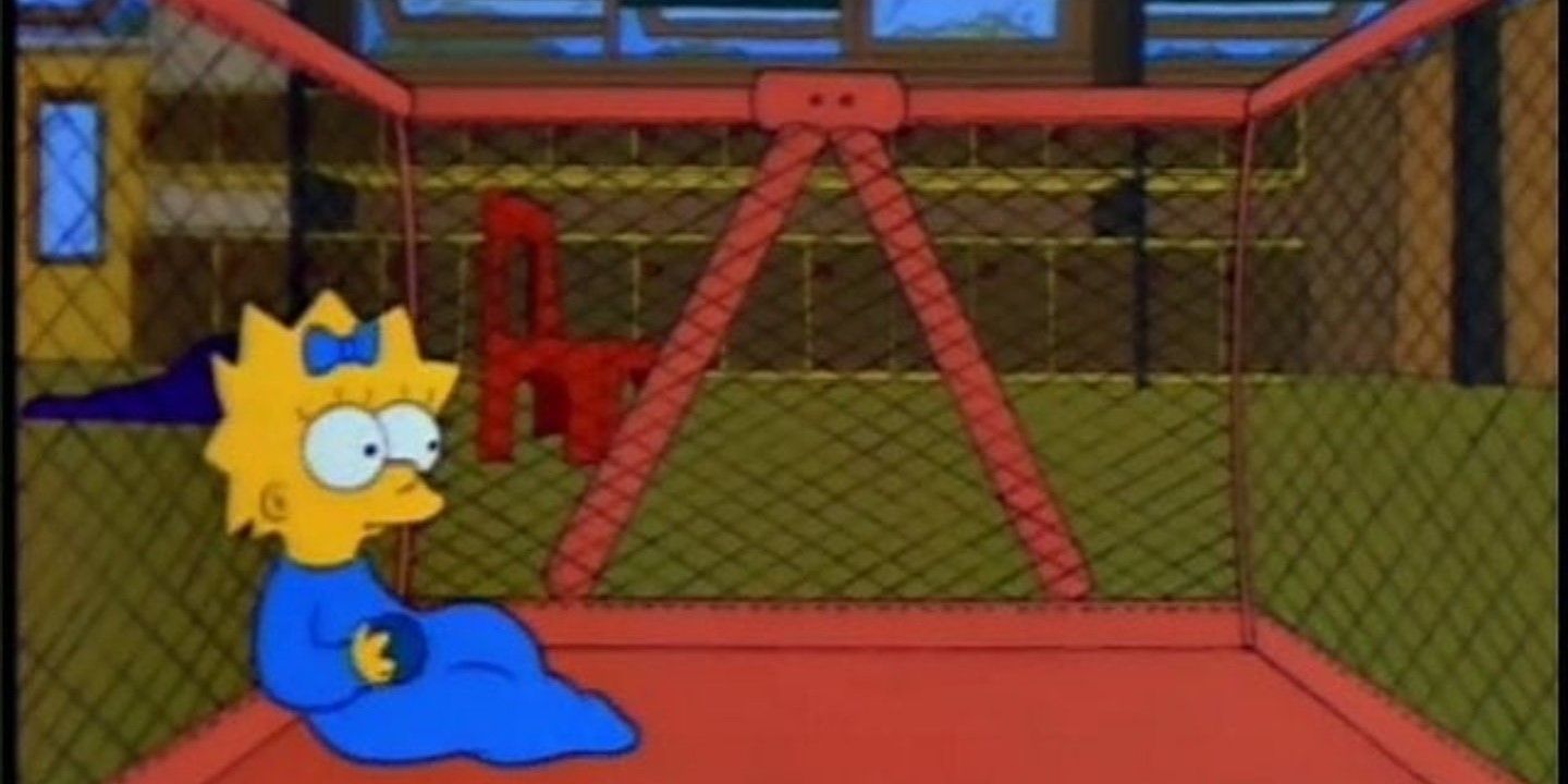 maggie-sitting-in-a-pen-alone-holding-a-ball