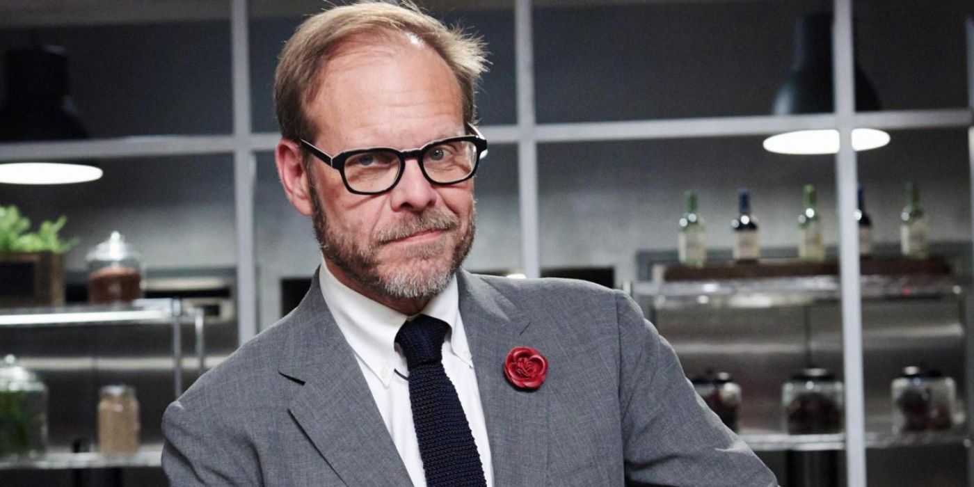 Alton Brown poses for a photo in a kitchen for the Food Network.