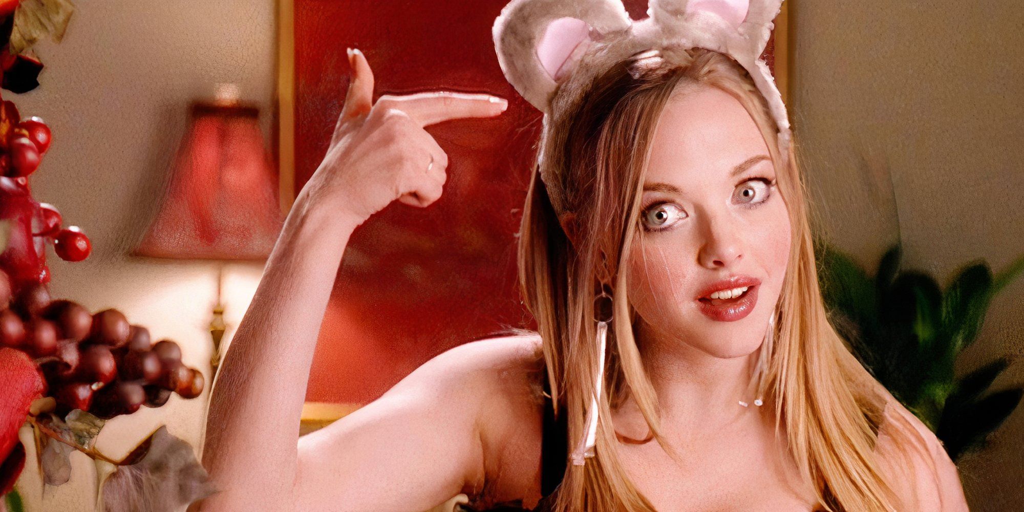 Amanda Seyfried as Karen Smith in Mean Girls pointing at mouse ears