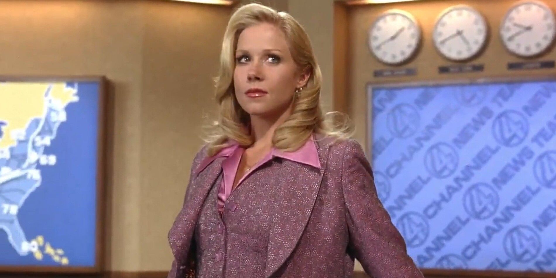Christina Applegate as Veronica Corningstone standing in front of the reporters desk on stage of the Channel 4 news station in 'Anchorman' 
