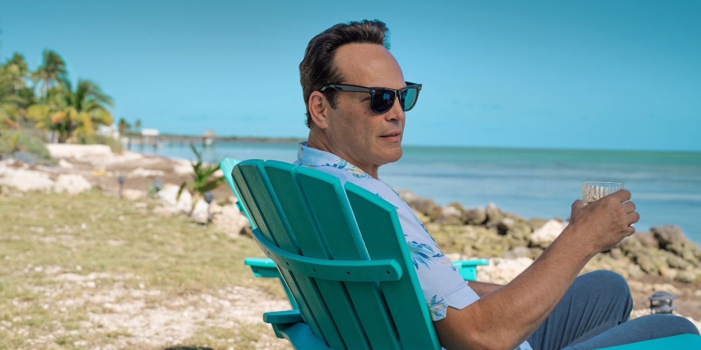 Vince Vaughn sitting in a beach chair with a drink in Bad Monkey Episode 1.