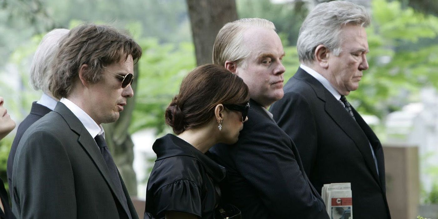 The cast at a funeral in Before the Devil Know You&rsquo;re Dead