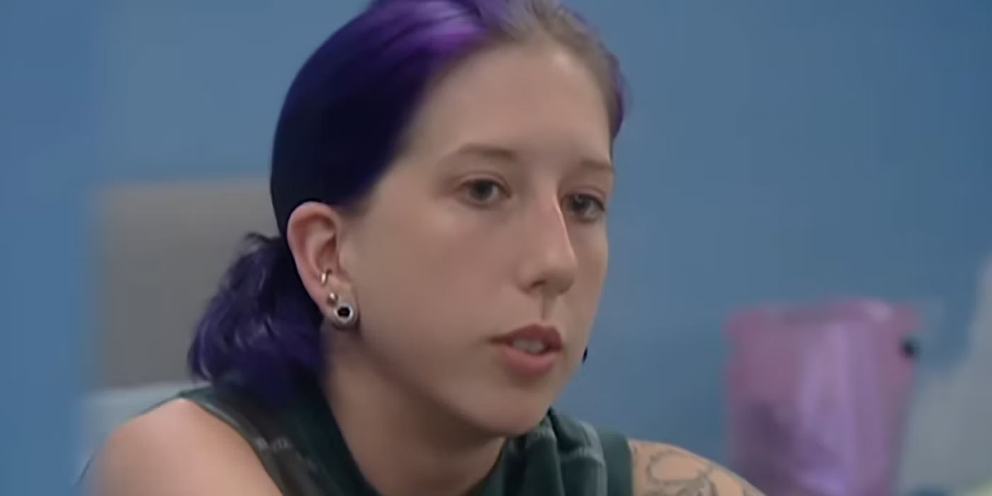 A closeup of Nakomis Dedmon with purple hair and a pensive look on her face in &lsquo;Big Brother&rsquo;