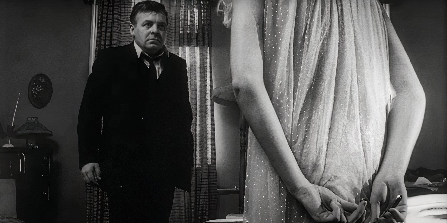 Patrick Wymark as the landlord stares menacingly at Catherine Deneuve as Carol in Repulsion