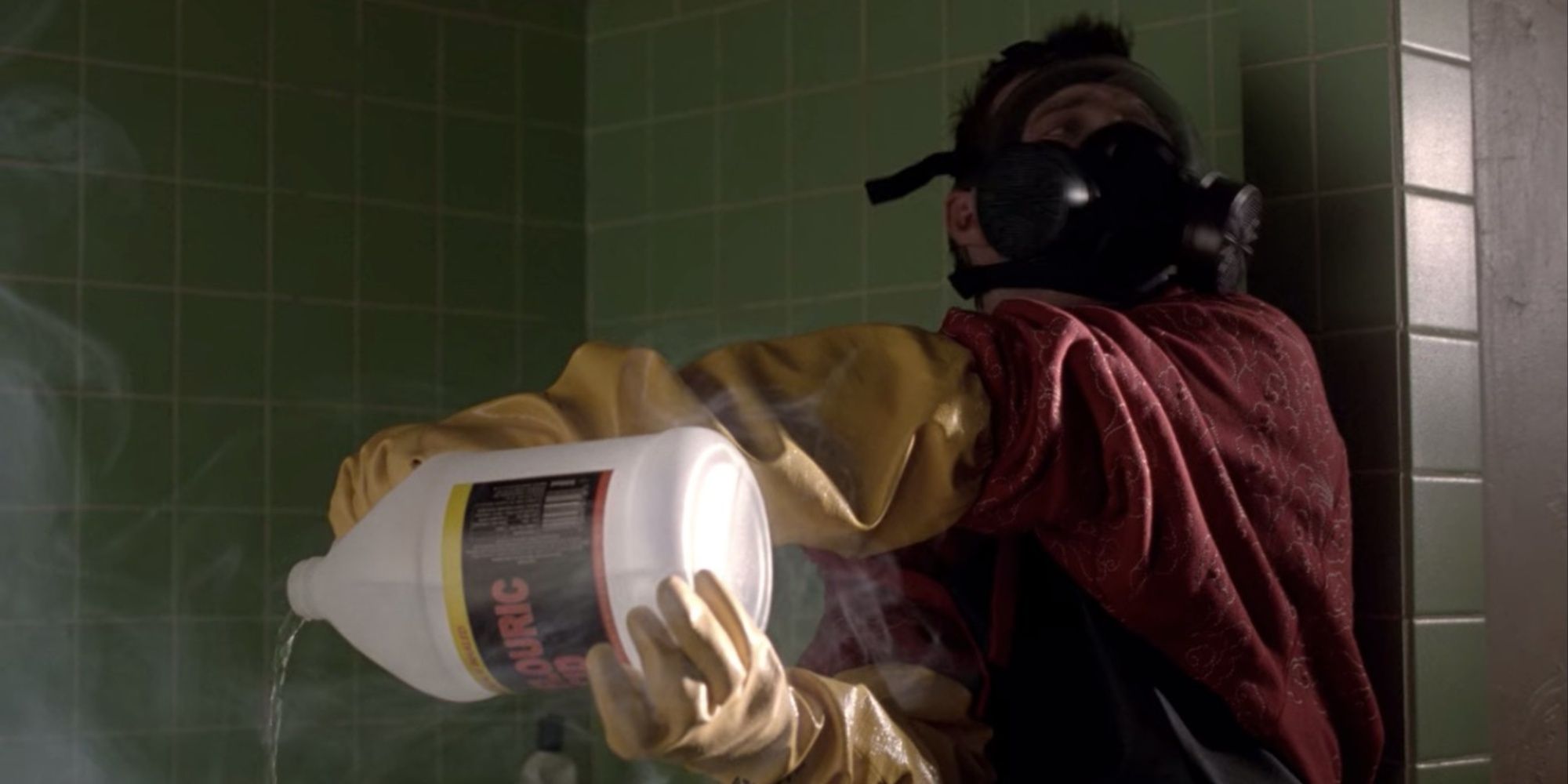 Jesse Pinkman (Aaron Paul) pours acid on himself in Breaking Bad and wears a gas mask