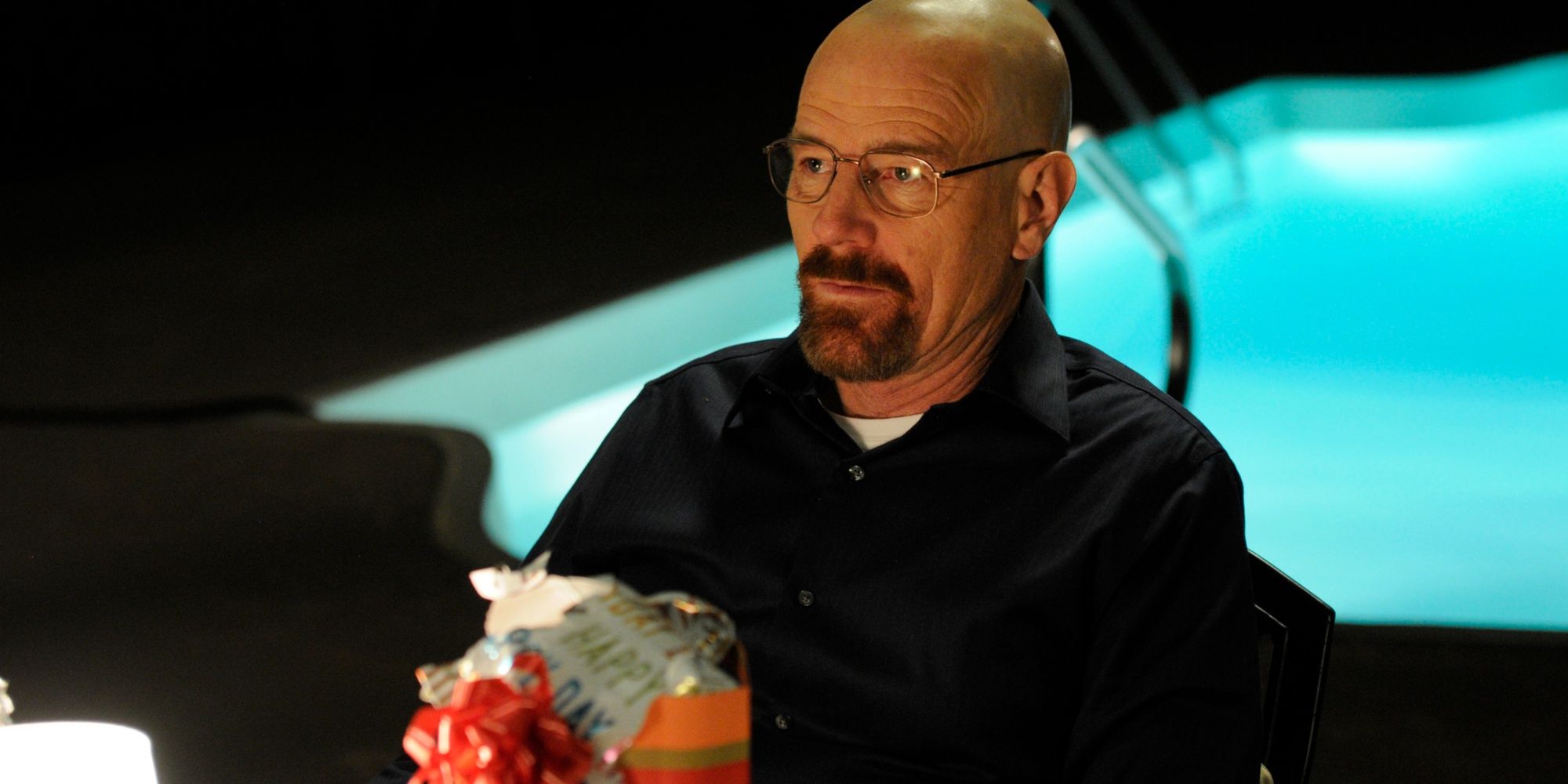 Walter White (Bryan Cranston) sits in his garden by the pool on his birthday in Breaking Bad