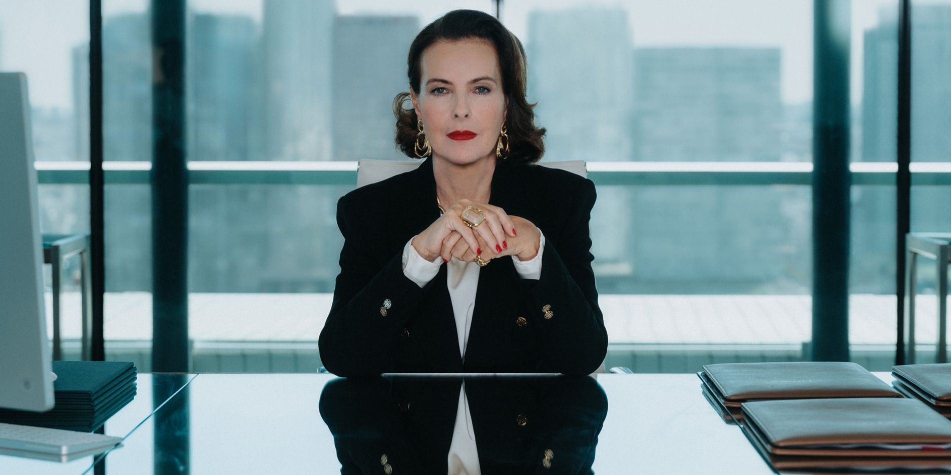 Carole Bouque sitting at a desk in La Maison