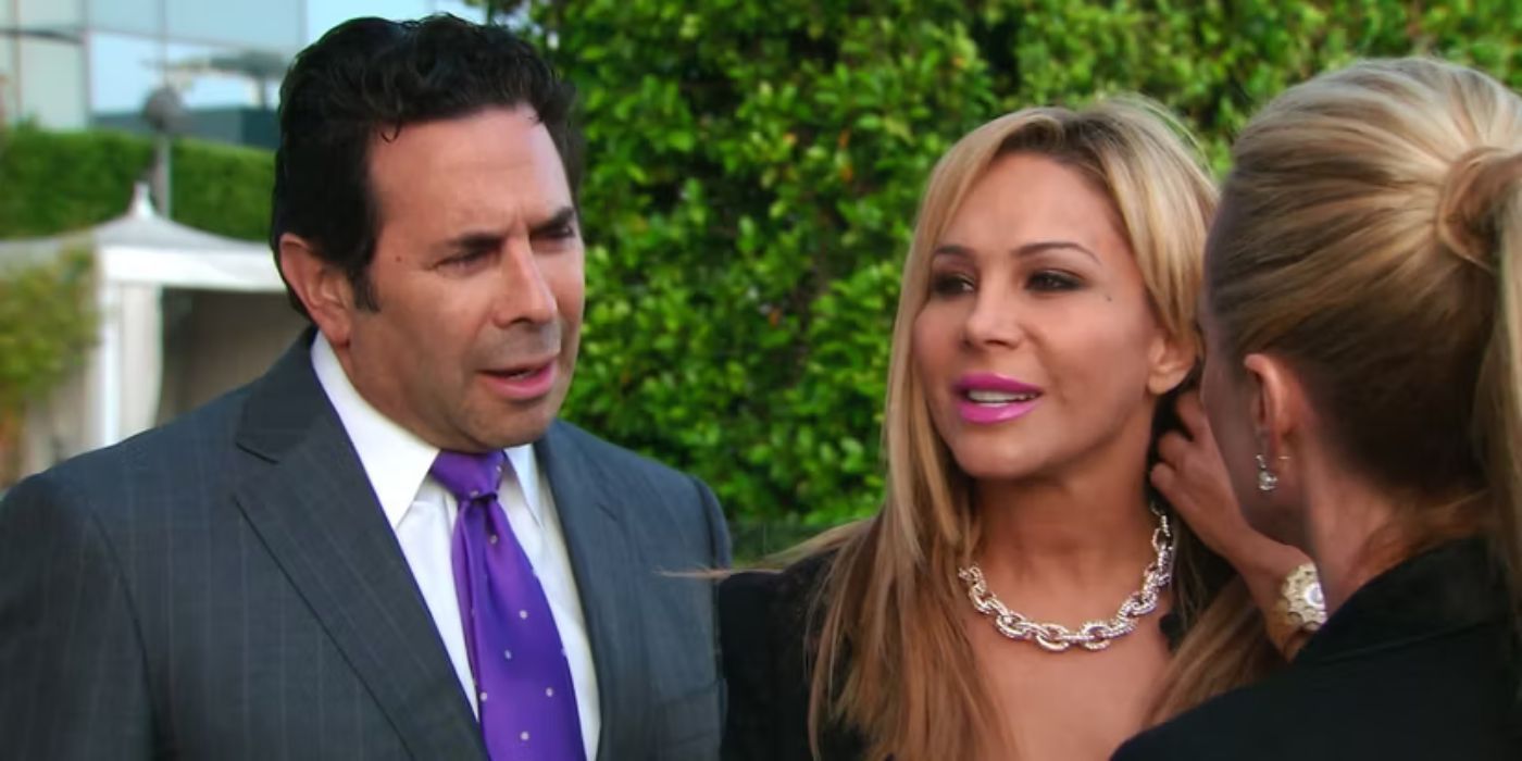 Dr. Paul Nassif and Adrienne Maloof stand together and look suspicious in The Real Housewives of Beverly Hills