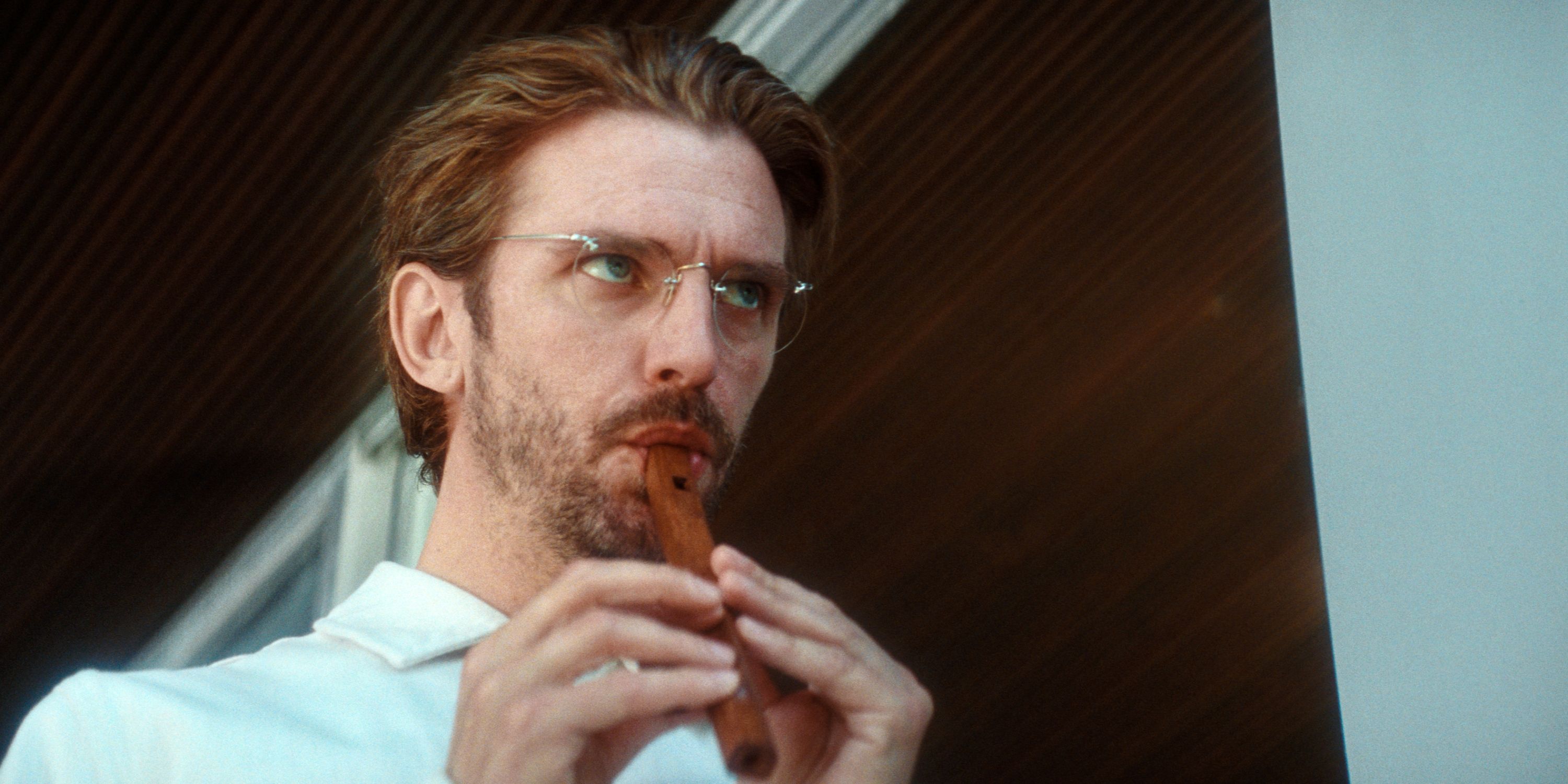 Dan Stevens as?Herr K?nig playing a little flute in Cuckoo