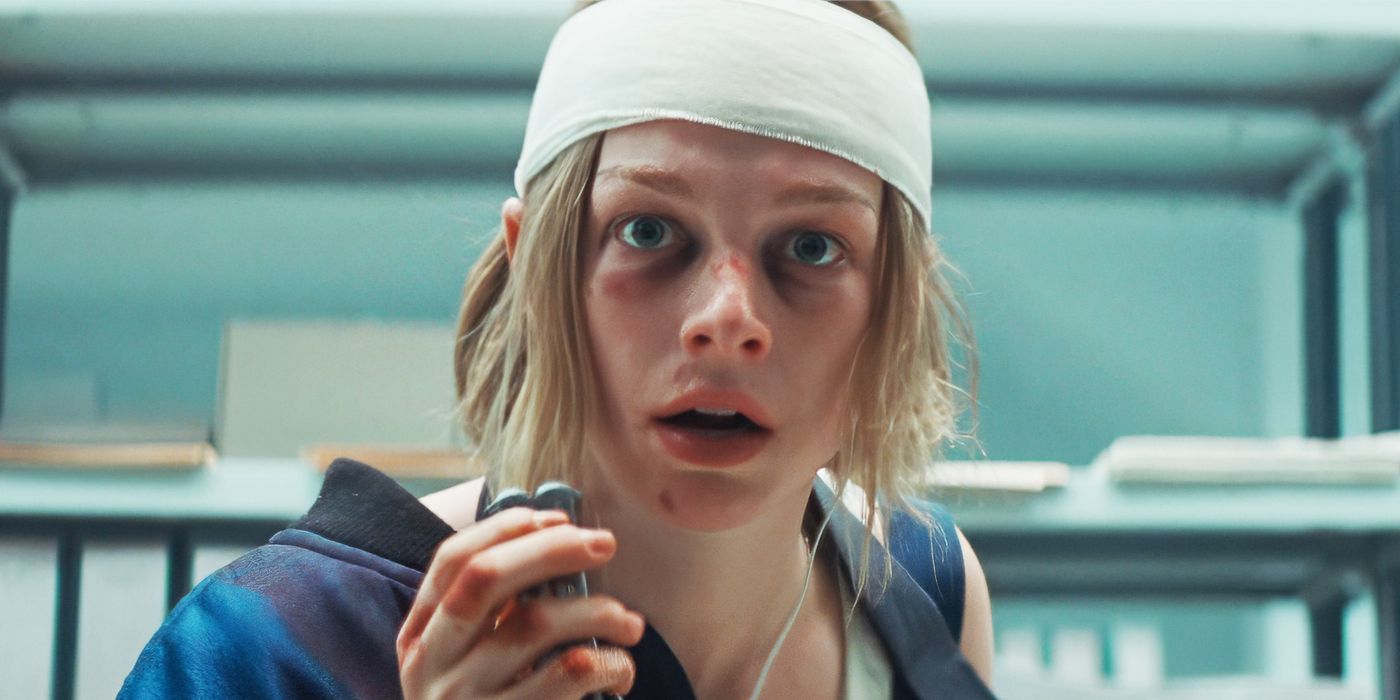 Hunter Schafer as Gretchen wearing a bandage holding a knife in Cuckoo.