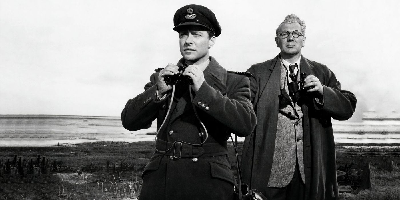 Two German officers observe something in the distance in 'The Dam Busters' 