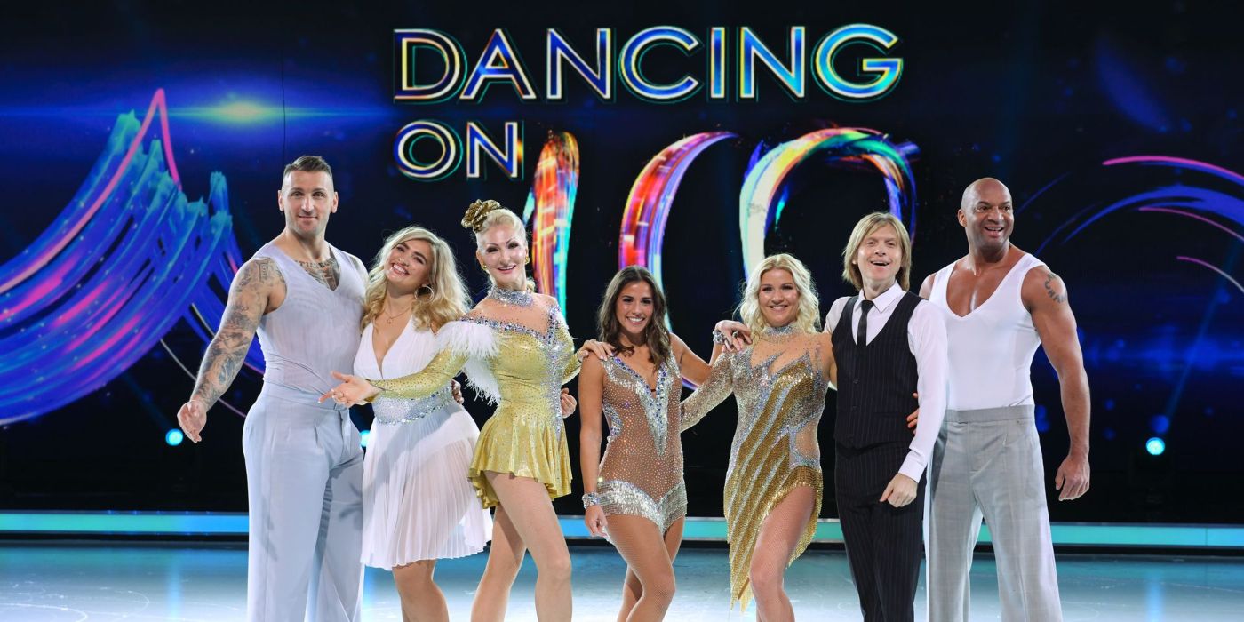 The contestants of Dancing on Ice pose together on ice in front of a backdrop with the show's logo. 