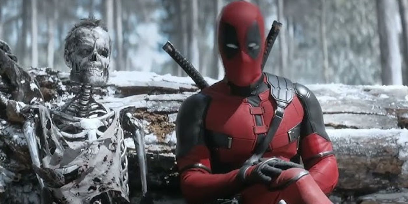 Deadpool (Ryan Reynolds) sits beside Logan's corpse in 'Deadpool & Wolverine'