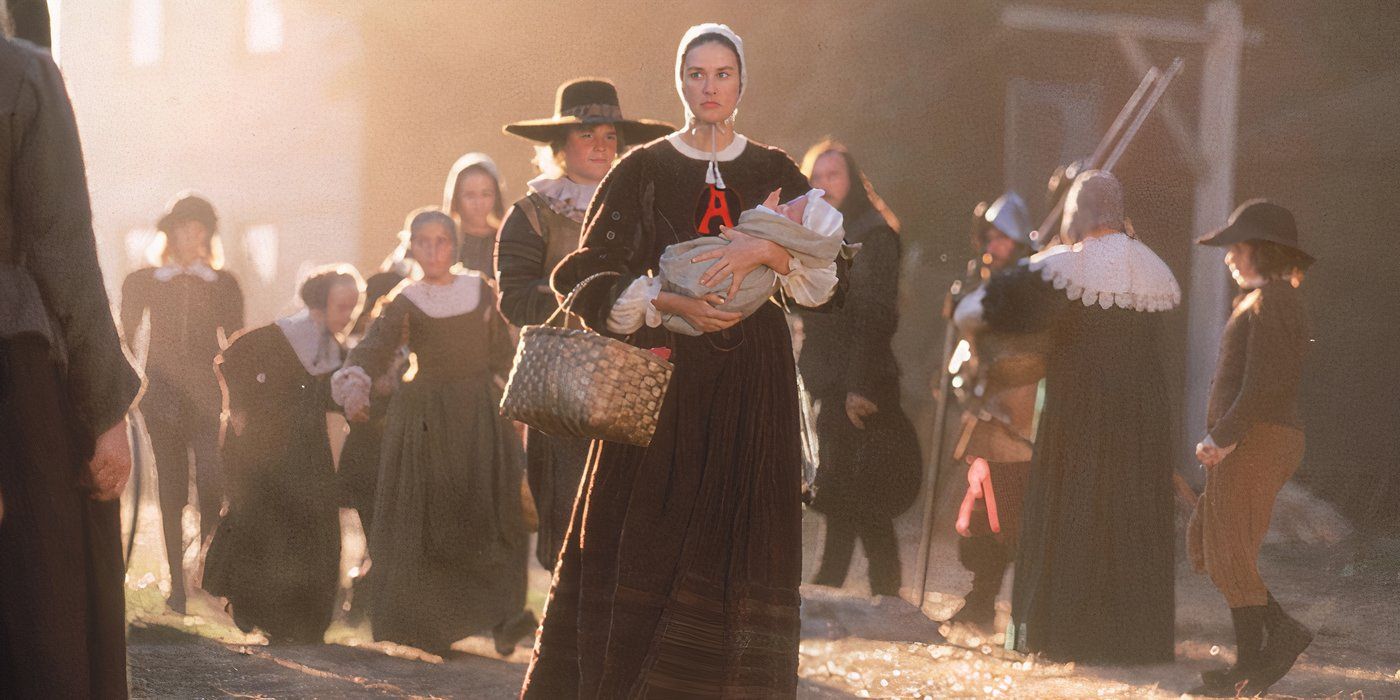 A puritan woman with a red A embroidered to her clothes walks through a crowded street with a baby in her arms in 'The Scarlet Letter' (1995)