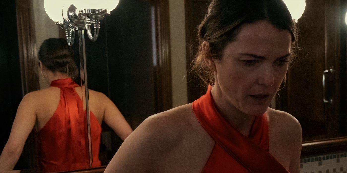 Keri Russell looks panicked in a bathroom while wearing a red dress in S2 of 'The Diplomat'