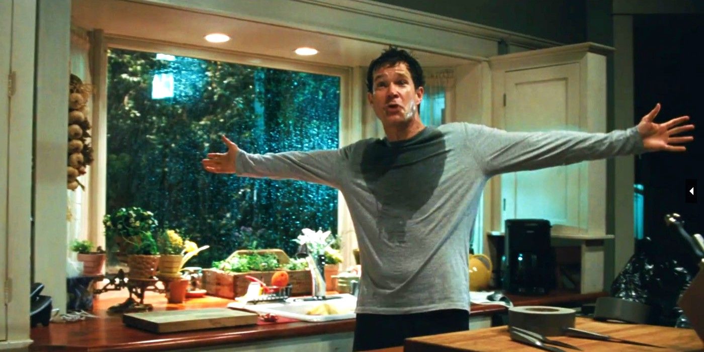 Dylan Walsh as David Harris with his arms outstretched in a sweat-stained gray shirt in 'The Stepfather' (2009).