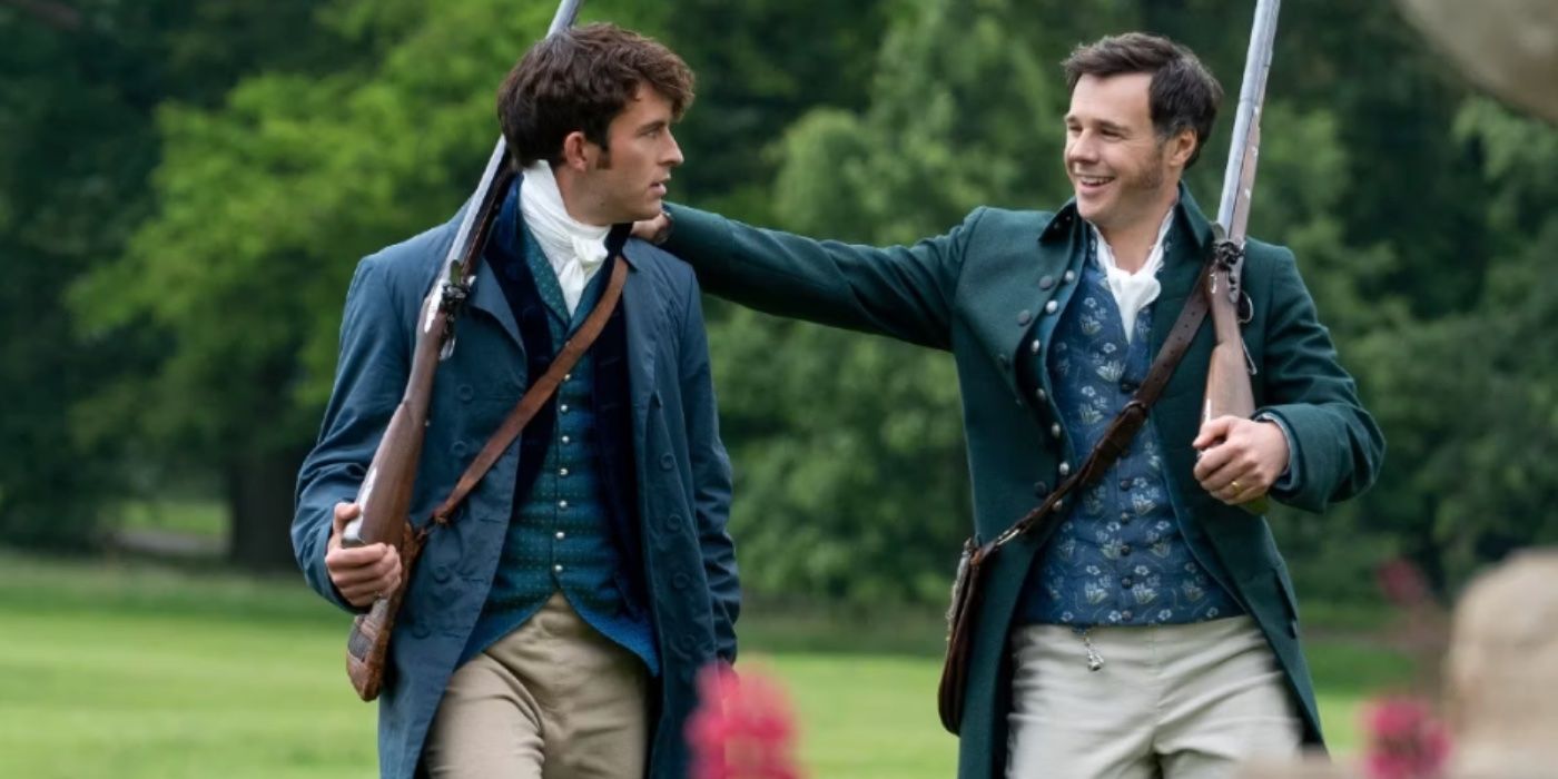 Edmund Bridgerton (Rupert Evans) placing an arm on his son, Anthony's (Jonathan Bailey), shoulder as they walk in the garden with their hunting rifles. Edmund chuckles while Anthony looks at him.