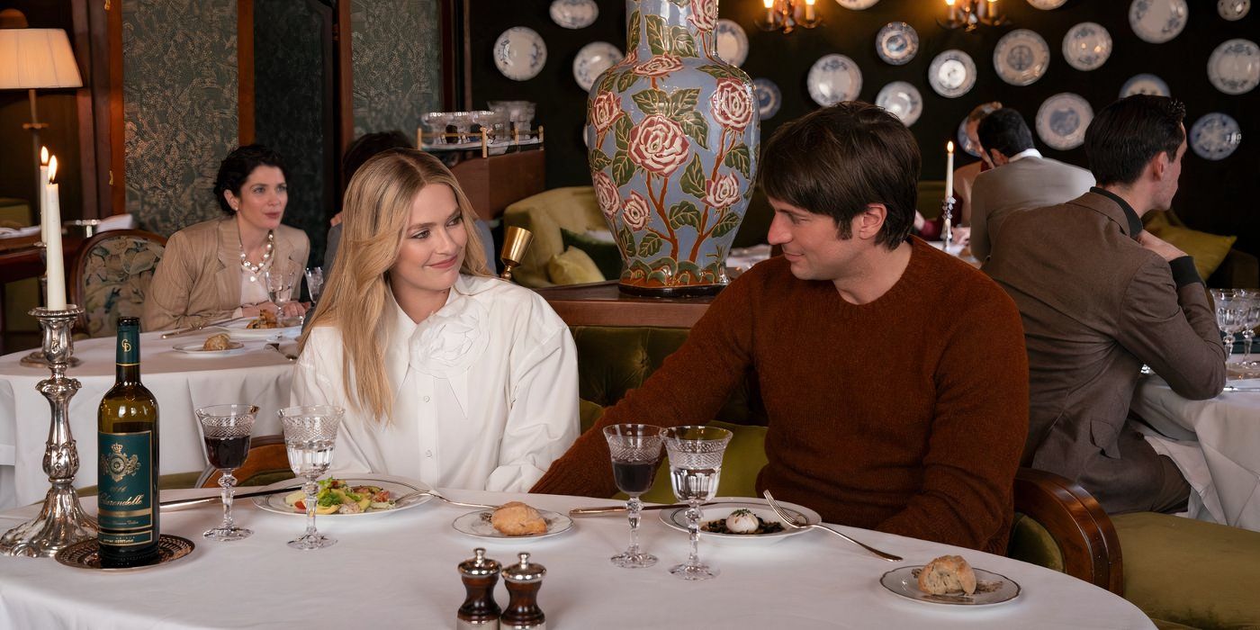 camille eats dinner with a man in red and she's in white