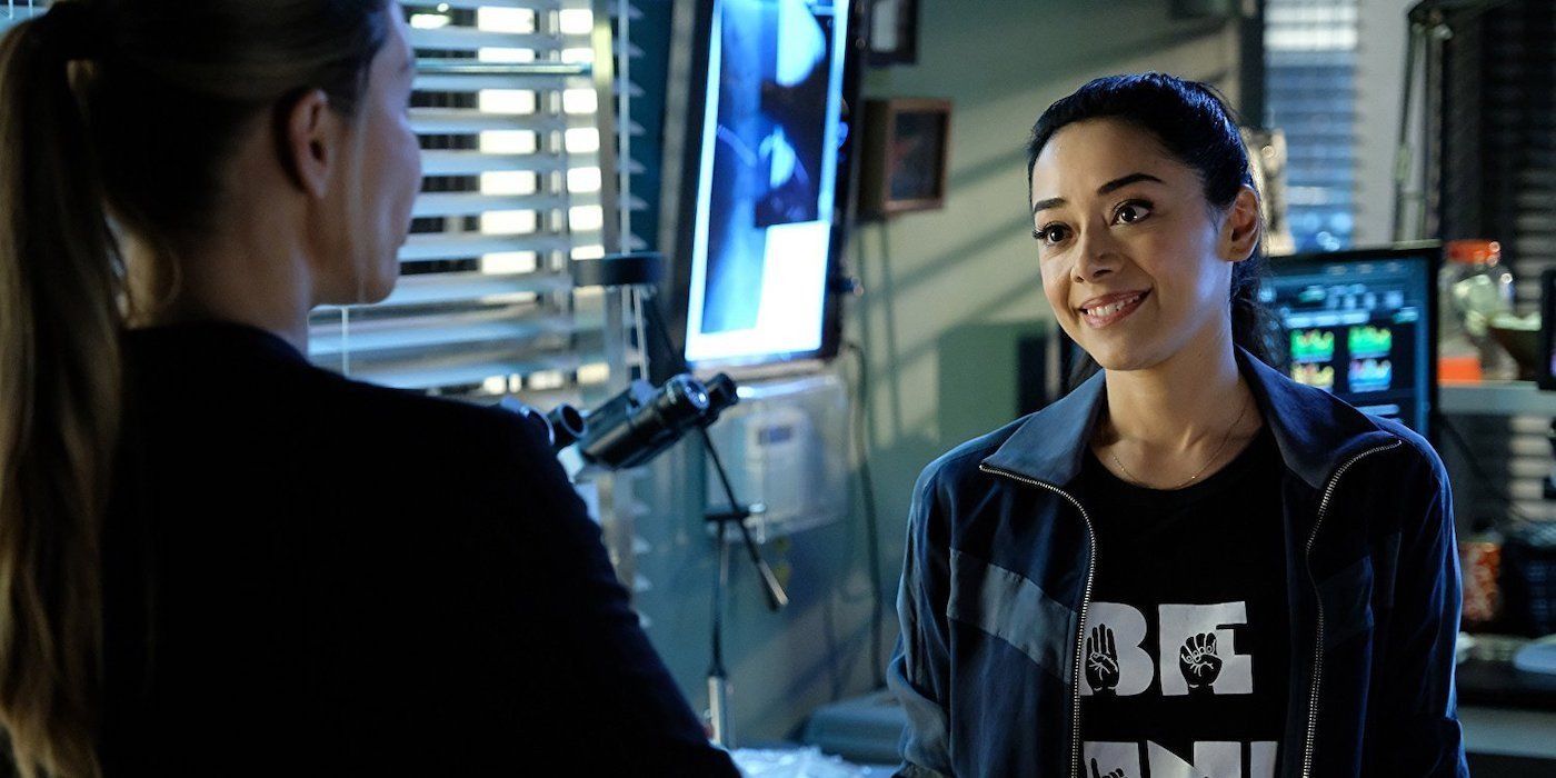 Ella from Lucifer smiling at Chloe in the lab.