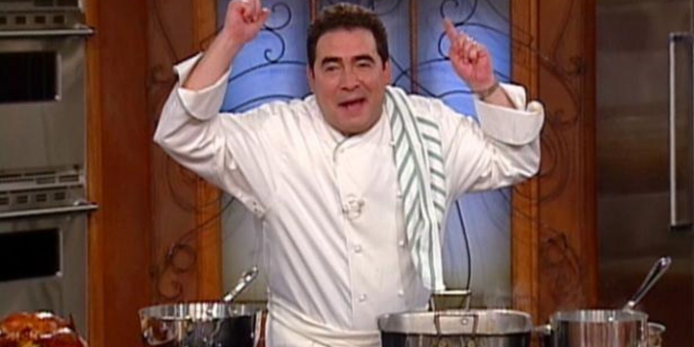 Emeril Lagasse stands over cooking pots wearing a white chef's jacket and gestures while he talks.