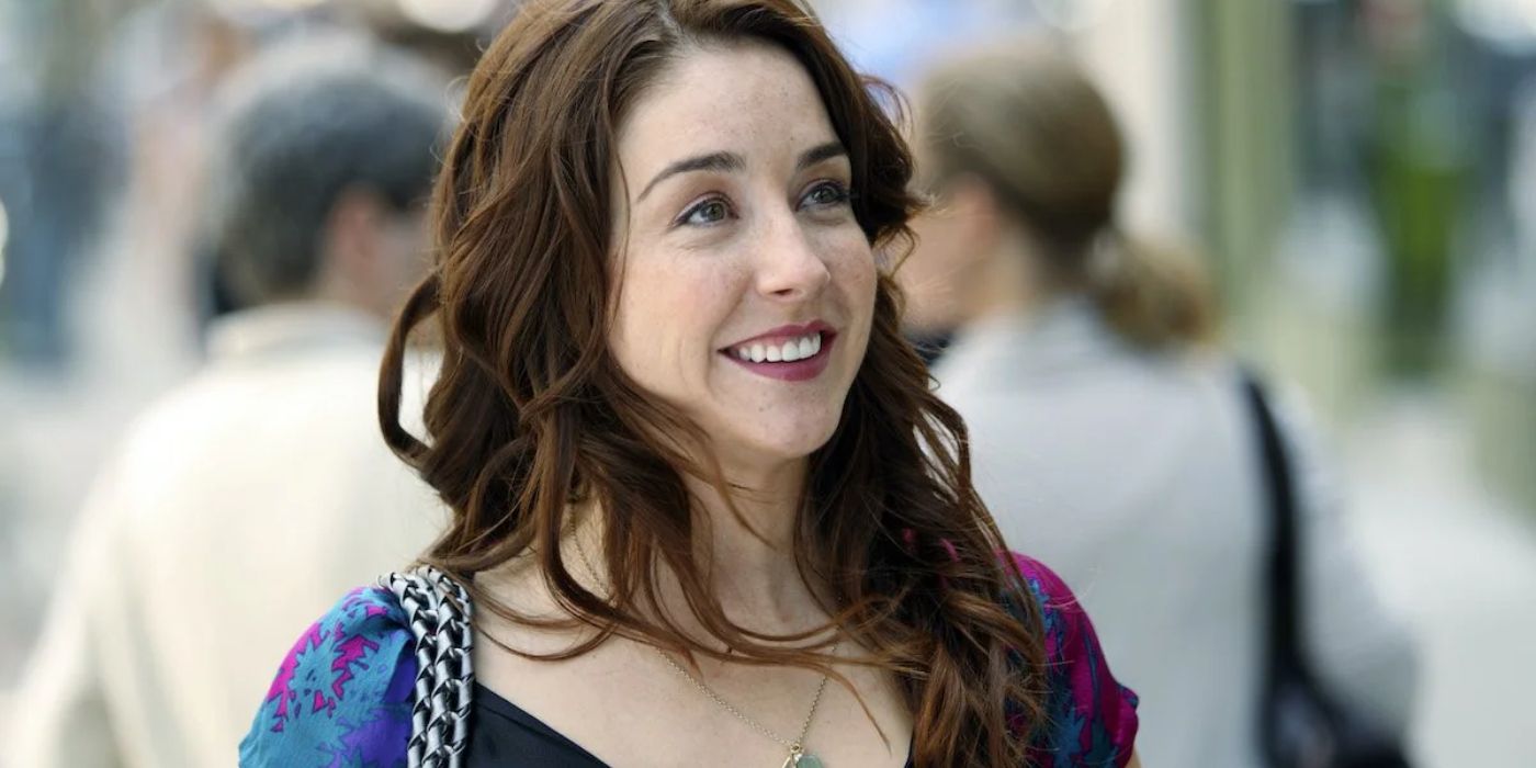 Erin Karpluck smiling and looking at something on the right side of the screen as Erica Strange in &lsquo;Being Erica&rsquo;