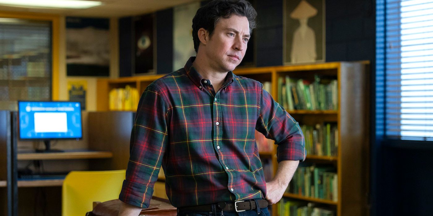 Brian Jordan Alvarez as Evan with his hand on his hip in the library in English Teacher. 