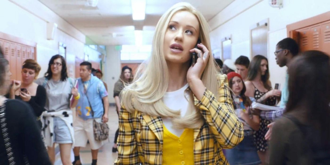 Iggy Azalea as Cher Horowtiz on the phone while walking down a hallway in the Fancy music video