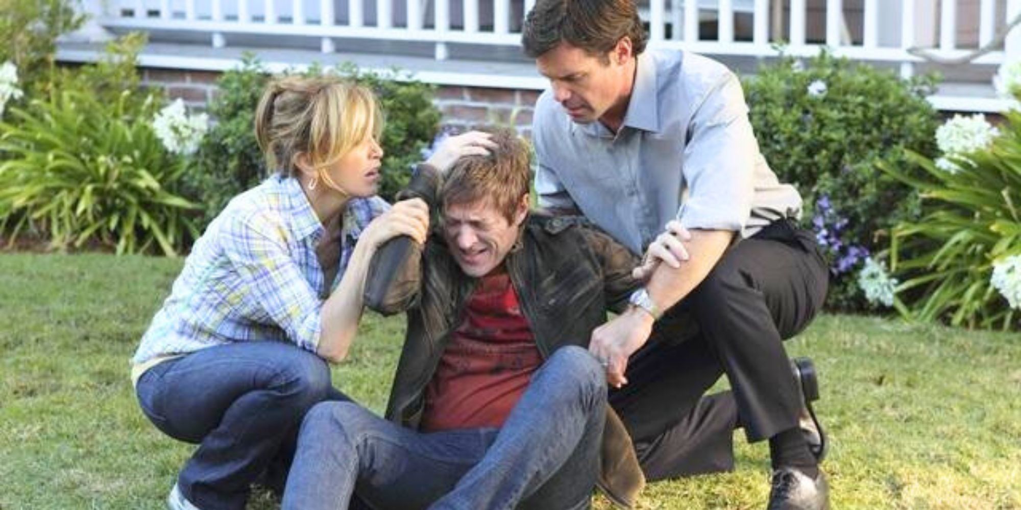 Felicity Huffman and Tuc Watkins helping Kevin Rahm up who is holding his head after being injured