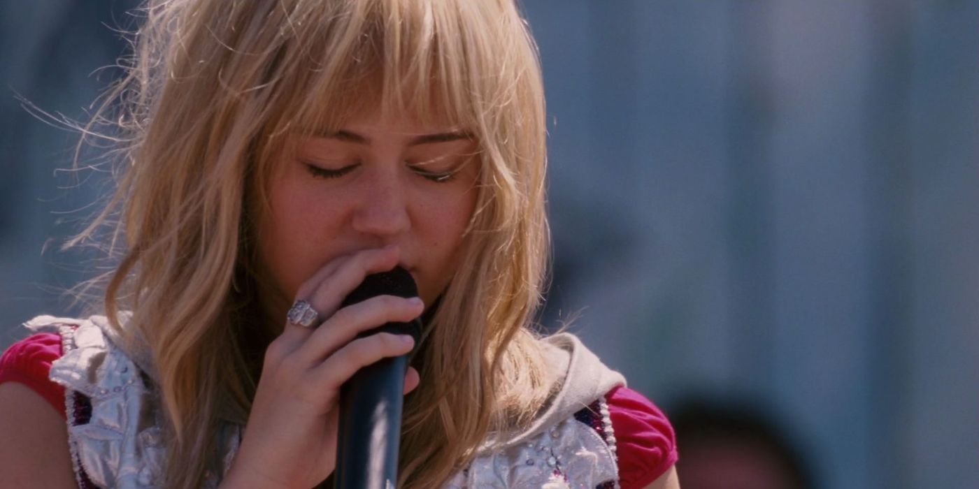 Miley Cyrus as Hannah Montana singing on stage in a scene from 'Hannah Montana: The Movie'.