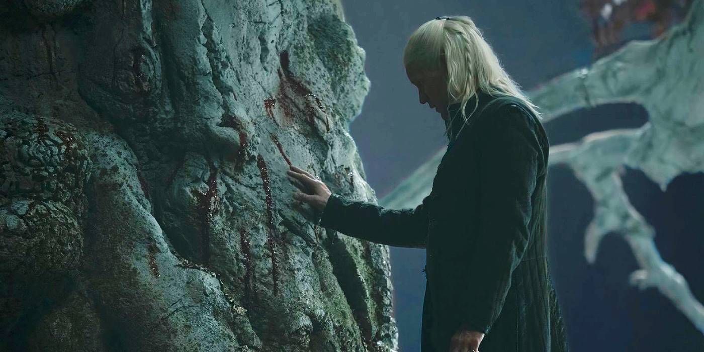 Matt Smith as Daemon Targaryen with his hands on a weirwood tree in House of the Dragon Season 2, Episode 8