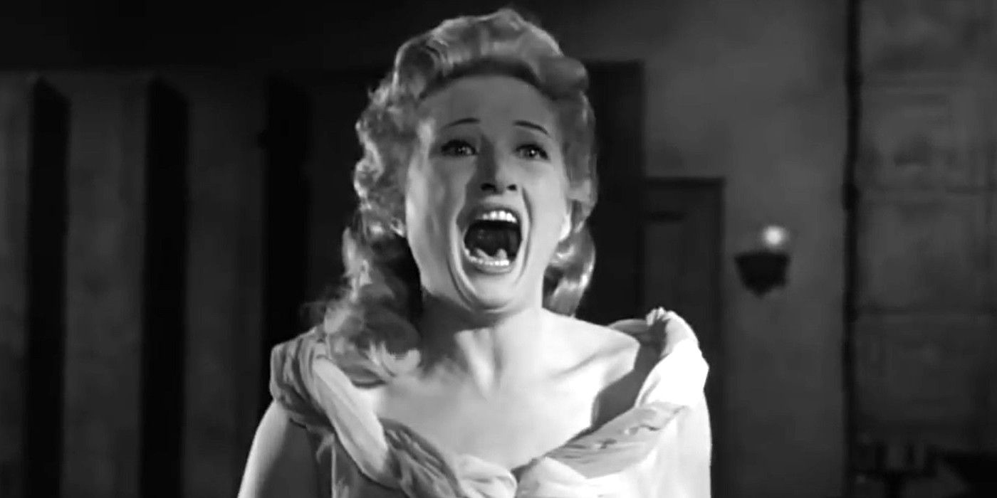 Carol Ohmart as Annabelle Loren screaming while wearing a white nightgown in 'House on Haunted Hill' (1959)