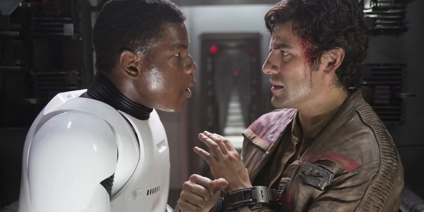 Finn (John Boyega) rescuring Poe Dameron (Oscar Isaac) in Star Wars: The Force Awakens