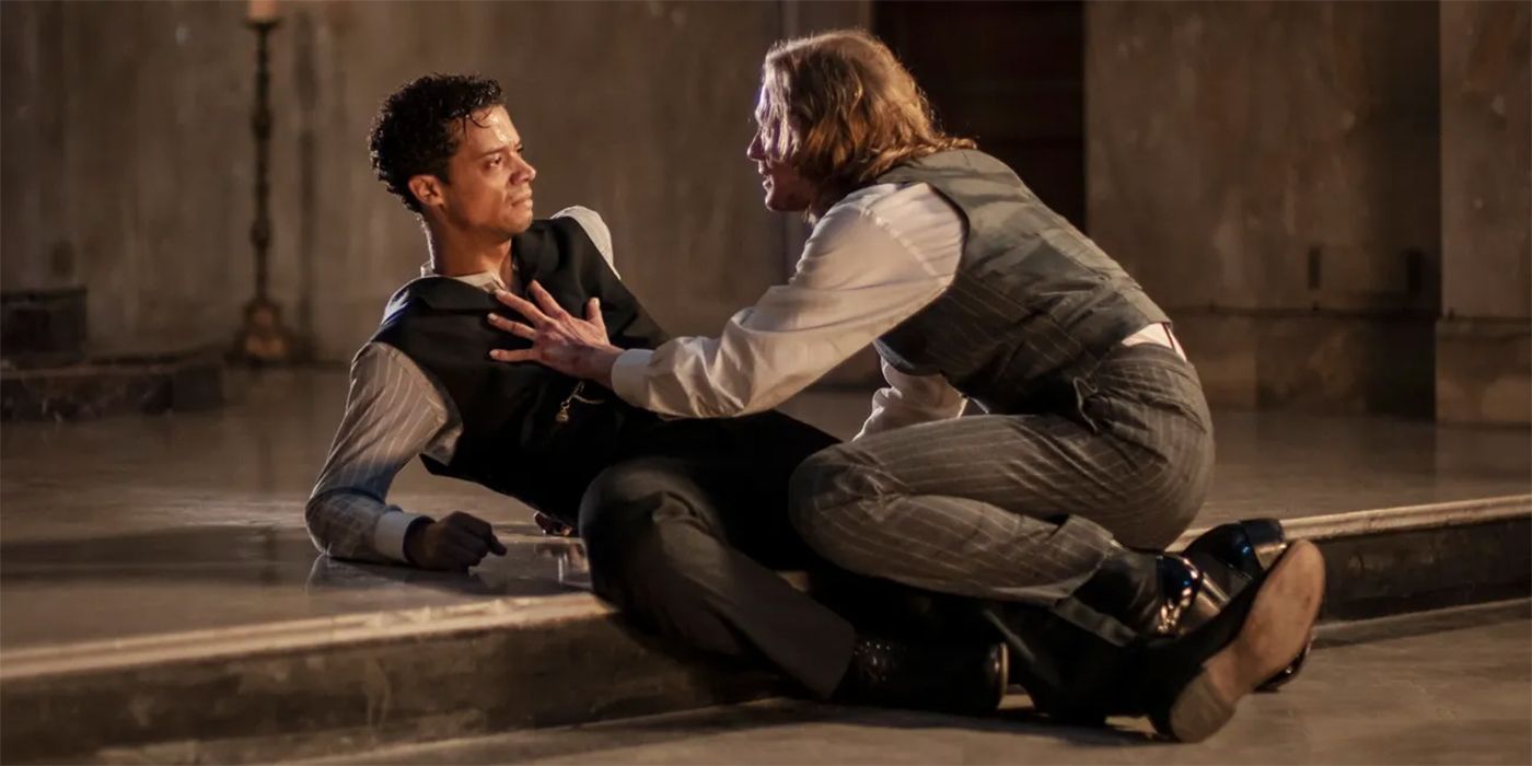 Sam Reid as Lestat climbing on top of Jacob Anderson as Louis in Interview With the Vampire