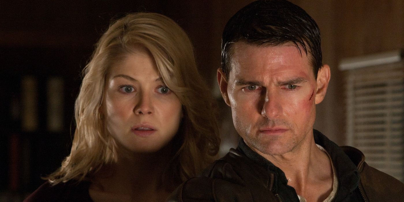 Tom Cruise as Jack Reacher and Rosamund Pike as Helen Rodin staring at something in Jack Reacher 