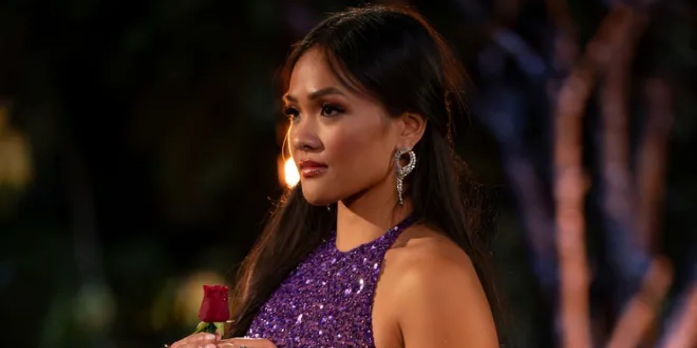 Jenn Tran wearing a sparkly purple dress and holding a red rose in 'The Bachelorette' Season 21, Episode 9.