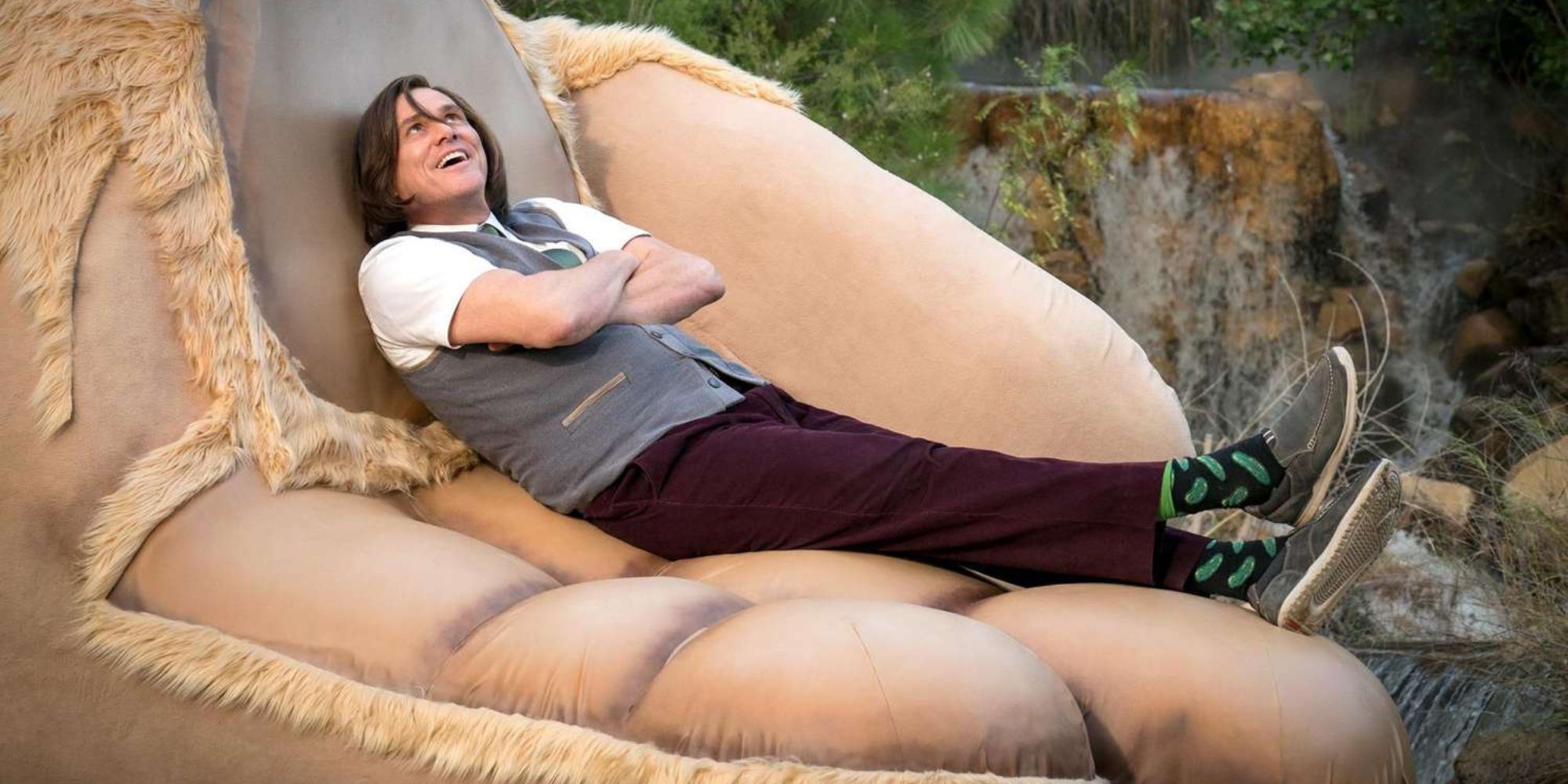 Jim Carrey laying in a giant hand in Kidding (2018-2020)